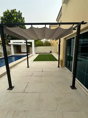 Outdoor metal pergola with retractable canopy — good condition