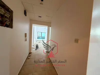 1BR + living room + 2 baths + built-in wardrobes | Free AC, 1 month free, parking, gym & pool | Near Dubai exit & services.