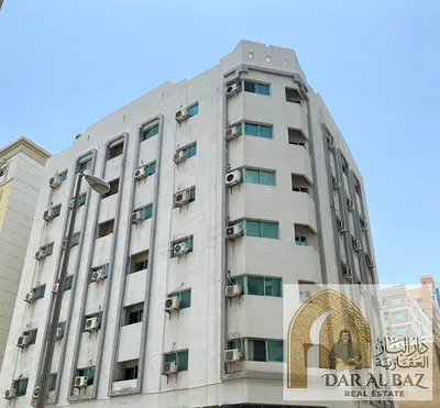 Investment building for sale in Al Qasimia – Sharjah | Fully rented | Annual income AED 780,000 | 6 floors + mezzanine + 3 shops
