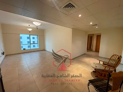 The most beautiful two-bedroom apartment with a living room, featuring free air conditioning, gym, and swimming pool in the finest towers of Sharjah