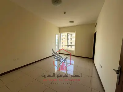 Largest two-bedroom apartment with a living room, balcony, parking, one month free, free gym access, panoramic view, excellent finishing in Al Qasimia