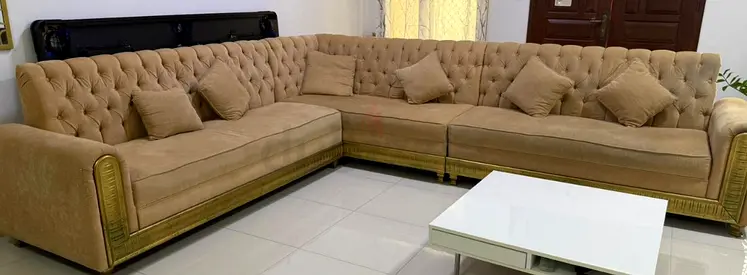 Large Beige Tufted L-Shape Sofa with Gold Accents