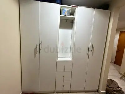White 5-door Wardrobe with Center Drawers and Open Shelf - Good Condition