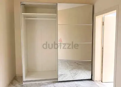 White sliding mirrored wardrobe — good condition, 2-door built-in style
