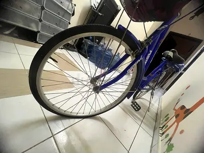 Blue city/commuter bicycle with rear rack and basket - good condition