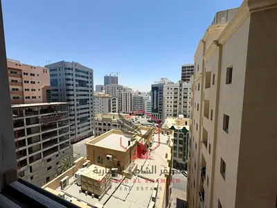 1BR apartment for rent in Al Qasimia Al Mahatta, free AC, stunning view, clean family tower.