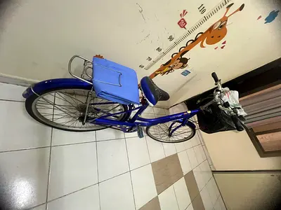 Blue city/commuter bicycle with rear rack and basket - good condition