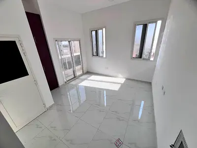 Studio in Al Aaliya, 2nd tenant, separate kitchen, wardrobes, central AC, free maintenance.