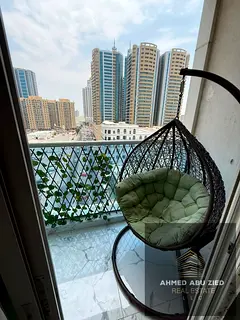 Luxury 2BHK, fully furnished living room in Oasis Towers - Ajman, luxury finishes, 3 bathrooms, balc