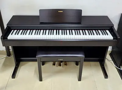 The Yamaha Arius YDP-105R is an 88-key digital console piano featuring GHS weighted action, AWM