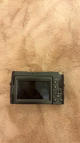 Compact digital camera (rear view) - powers on, screen & buttons shown