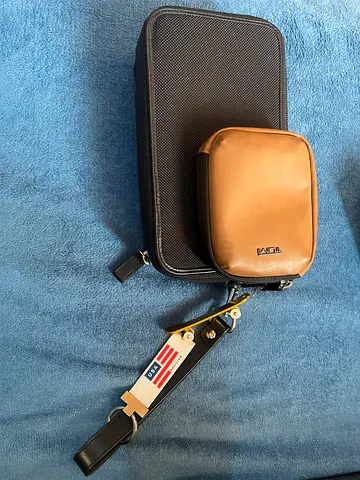 Brand name original Tumi Small black travel case with detachable brown pouch and strap
