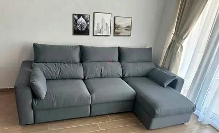 Premium fabric sofa bed with stylish finish. Large storage space for blankets, pillows, and other es