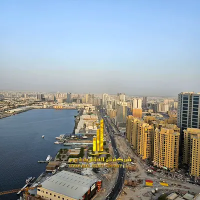 Two-bedroom apartment with a living room in Ajman - Al Rashidiya 1 - Oasis Towers - furnished with new furniture for monthly rent