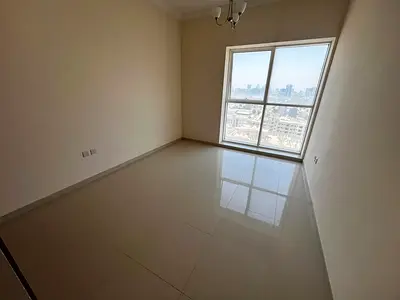 2BR apartment in Al Mina St, spacious, balcony with great view, 3 bathrooms, master room, built-in wardrobes, central AC, maintenance included.