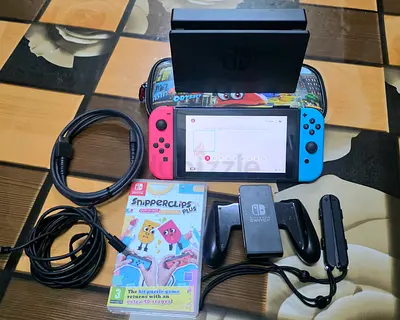 NINTENDO SWITCH +1 GAMES WITH BAG