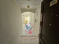 Apartment for annual rent - Al Qasimia. Spacious areas, open view with balcony, free maintenance, ce