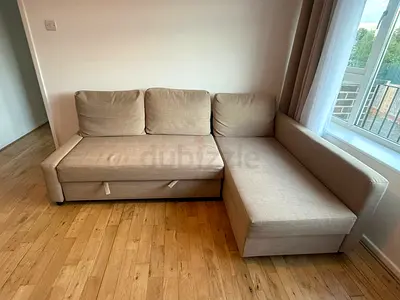 Beige L-shaped Sofa with Storage - Good Condition