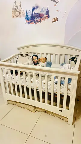 Solid white wooden baby crib - good condition