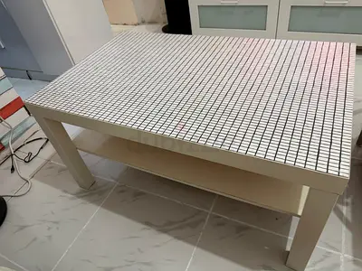 White rectangular coffee table with tiled top and lower shelf