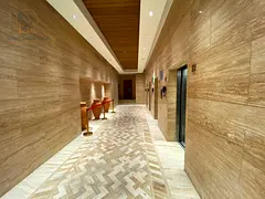 Annual rental apartment in Al Nakheel, first tenant, 3 bedrooms, sea view, maid room, laundry room, 