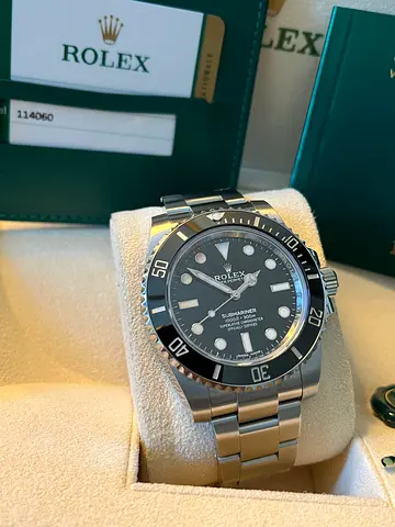 Rolex submariner 114060 40 mm 2020 box and papers.