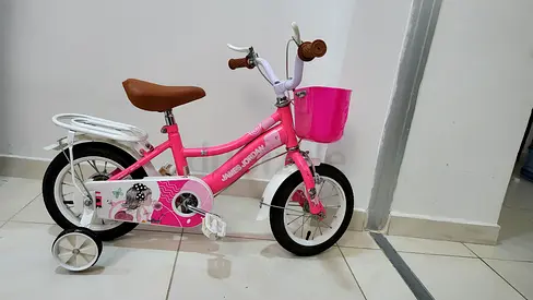 Pink Kids' Bicycle with Training Wheels, Front Basket & Rear Seat for 100 dhs Must Go Today