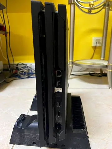 PlayStation PS4 1 TB with DualShock 2 controller with charging Docked