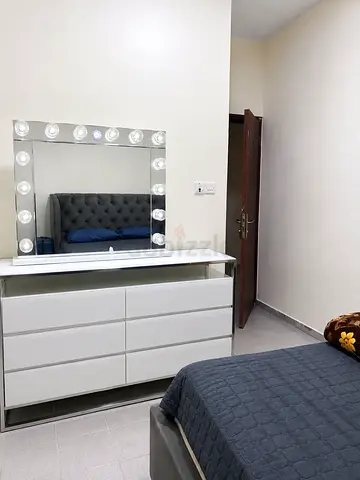King size bed with mirror and table