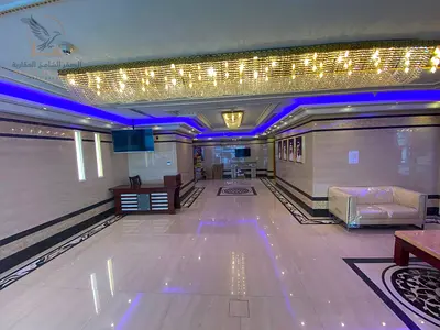 Two-bedroom apartment with a living room and private parking available for annual rent on Khalifa Street, opposite Grand Mall. Near Murad Mall.