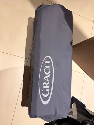 Graco Pack 'n Play Portable Playard (folded, with carry cover)