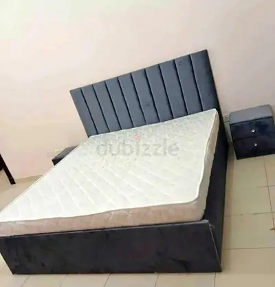 King size upholstered bed frame with mattress and bedside tables