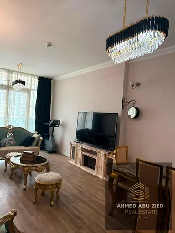 Two-bedroom apartment with hotel-style furnishings for annual rent in Al Waha Towers, Ajman. Featur