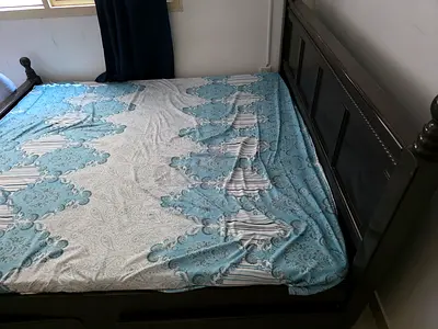 Solid dark wood double bed frame with headboard and storage box - good condition