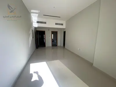 For annual rent: Brand new 3-bedroom apartment with a living room, first occupancy, in Al Nuaimiya 1, next to Al Hikma School, in a prime location.