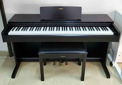 The Yamaha YDP-103R (Rosewood finish) is an entry-level console digital piano from the Arius series.