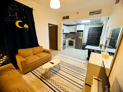 Furnished studio apartment for monthly rent with gym and pool access, including bills, in Al Rashidiya Clock Tower 1. Prime location near Safeer Mall