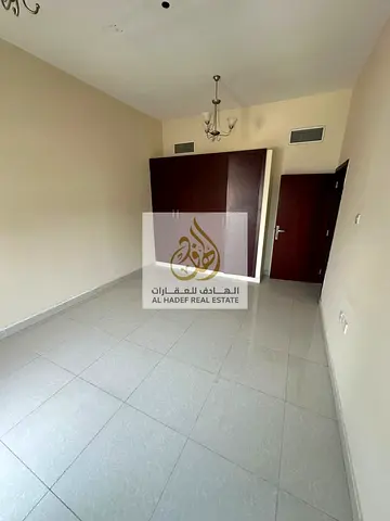 Two-bedroom apartment with a hall for annual rent, with built-in wardrobes and a balcony