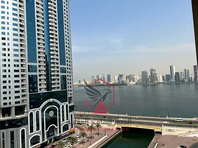 Beautiful two-bedroom apartment with a living room, balcony, and free parking. Sea view. Master bedrooms for rent in Al Majaz 3.