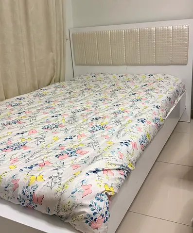 Ivory  single  bed frame with padded headboard - good condition