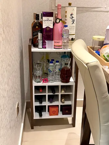 Small wooden bar cart with wine storage and tabletop