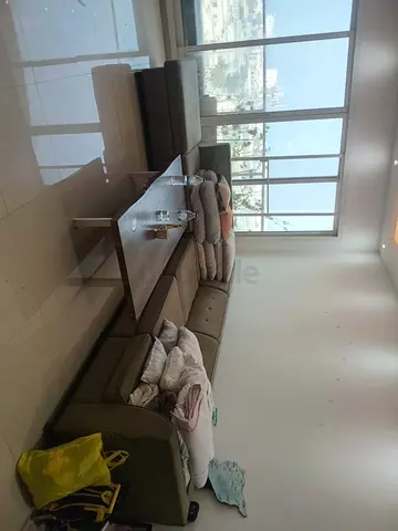 L-shaped fabric corner sofa with coffee table - good condition