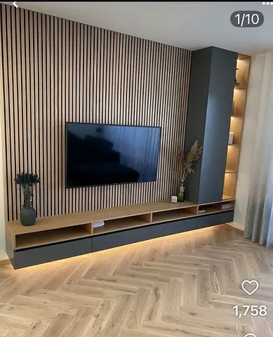 Modern wall-mounted TV unit with slatted feature wall and storage