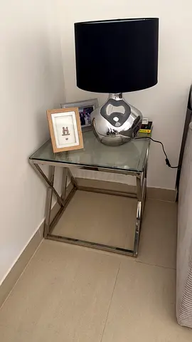 2 glass and steel side tables