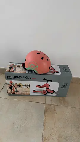 Scooter with a helmet
