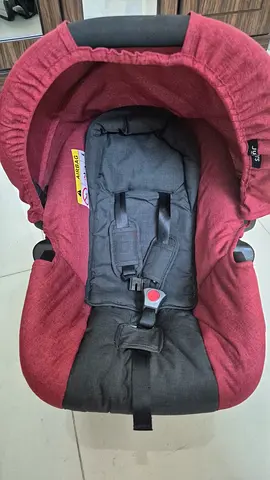 Infant car seat (rear-facing) in good used condition - red/black