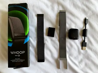 Whoop 4.0 Fitness Tracker with black band and Superknit Band and Accessories