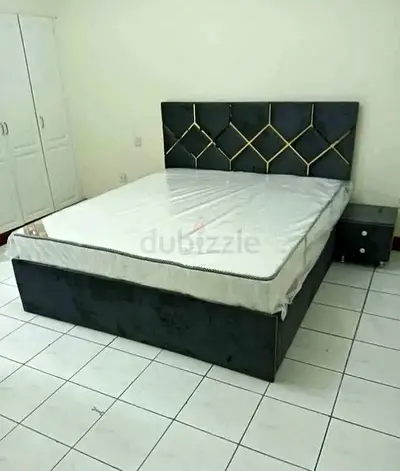 King size upholstered bed frame with headboard and mattress