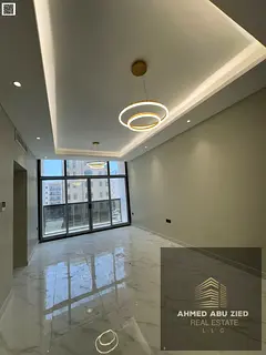 Best 2BR yearly rental, spacious bedrooms, large hall, modern finishes, elegant decor, balcony, open