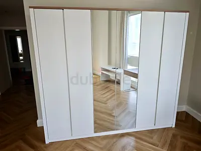 White 6-Door Wardrobe with Center Mirror - Excellent Condition